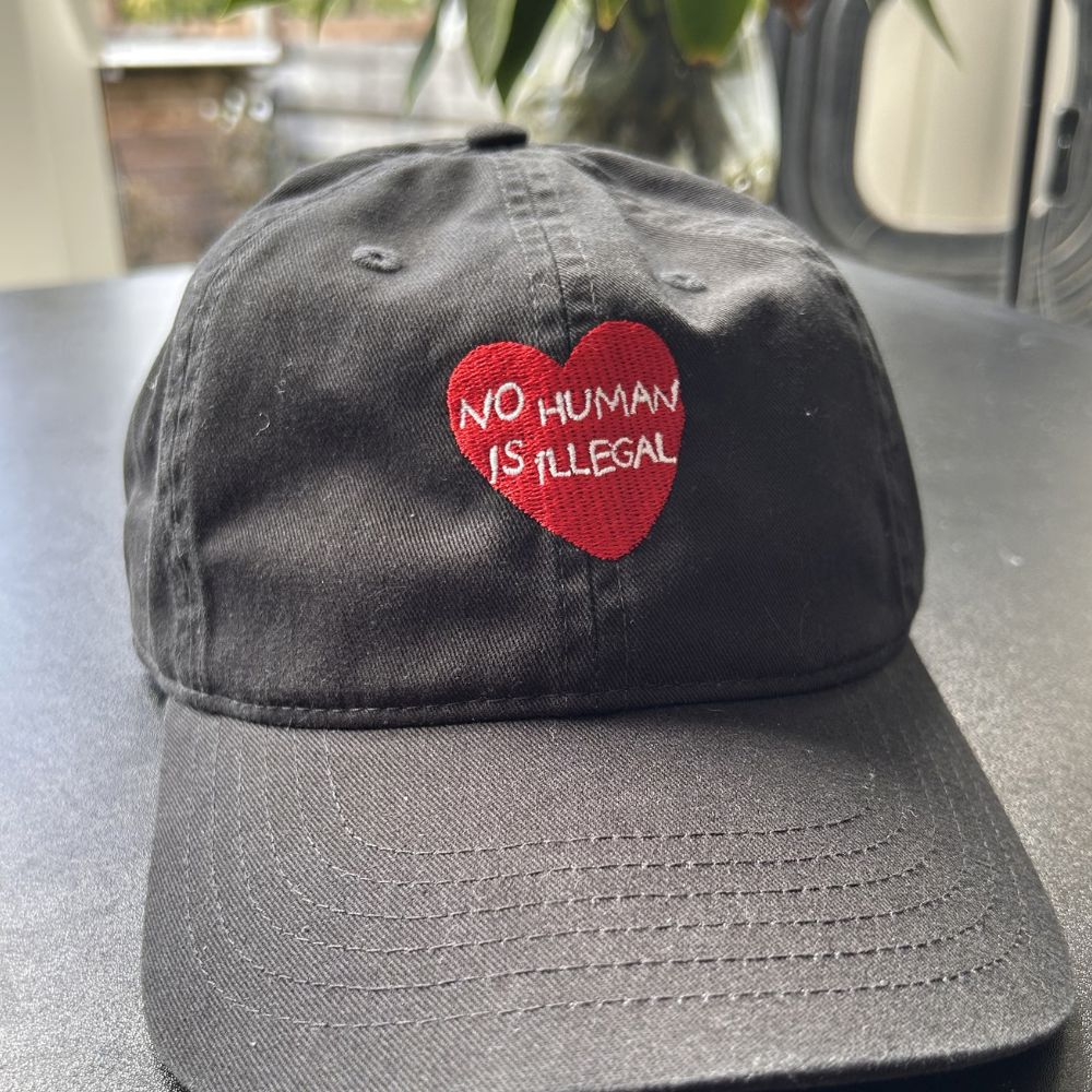 No Human is Illegal Dad Hat